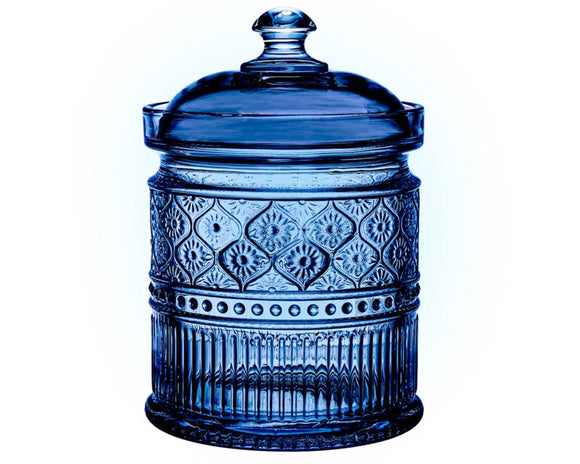 Blue glass jar with decorative patterns on a white background