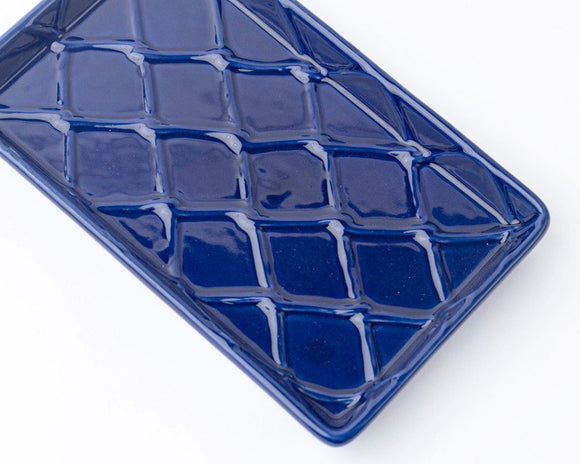 Blue textured rectangular guest paper towel tray on a white background