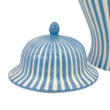 Blue and white striped ceramic lid on a white background