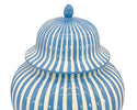 Blue and white striped ceramic jar with a lid on a white background