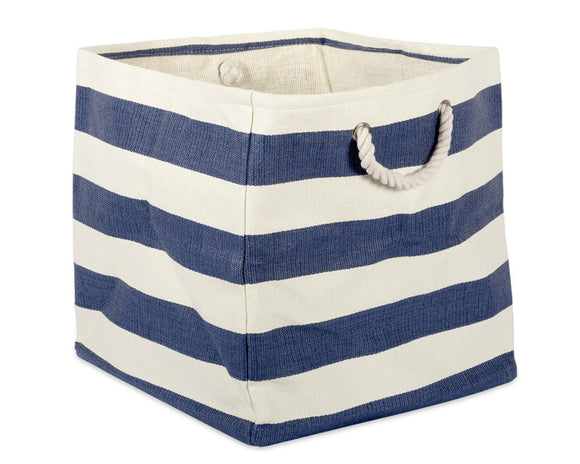 Blue and white striped storage basket with a handle on a white background