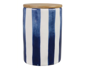 Cylindrical container with blue and white striped design and wooden lid on a white background