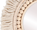 Bohemian style neutral fringe mirror

Featuring a border of cotton ropes with fringe ends and wooden beads around the edge, this mirror adds just the right amount of bohemian style to your space. It is easy to display via the attached hanger on the back.&nbsp;

Materials:
Fabric, wood, glass

Dimensions:
13 3/4" diameter