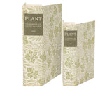 Green botanical storage book box set

These book boxes feature a textured canvas wrap displaying the exterior of a vintage book with plant patterns on the covers. The book title on the side reads, "Plant - Year Book Of Agriculture 1890," to give the appearance of a book spine when on a shelf. Front covers open to reveal a velvet lined space for storing items with a magnet closure for secure storage when standing up.&nbsp;

Materials:
Canvas, chipboard, velvet, magnet