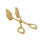 Decorative gold scissors on a white background