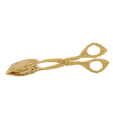 Decorative gold scissors on a white background