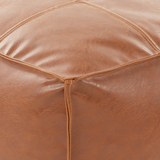 Close-up of a brown leather pouf with visible stitching, Inverness Ridge, Man cave decor