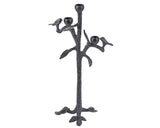 Decorative black metal candle holder shaped like a branch with birds on a white background