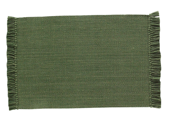 Elevate your table with the understated beauty of our evergreen woven placemat. Crafted from a blend of three complementary color hues, this placemat features a soft, heathered look that adds depth and texture to any tablescape. The solid weave is accented with tasseled edges at either end, bringing a relaxed yet refined touch to everyday dining or casual entertaining. 