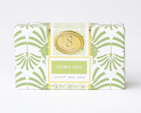 Luxury bar soap packaging with green leaf pattern on a white background