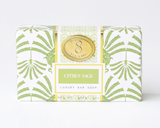 Luxury bar soap packaging with green leaf pattern on a white background
