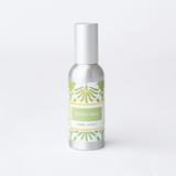 Silver room spray bottle with a green label on a white background
