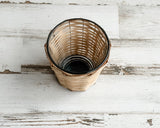 Bamboo &amp; copper votive candle holder

Bring a natural element into your home with our bamboo- and copper-wrapped glass votive candle holders. Each votive is expertly crafted and handwoven from sustainably sourced bamboo. Add it to a table or shelf for a glowing fixture that sets the mood of your chosen theme.

Materials:
Glass, copper, bamboo

Dimensions:
2 3/4" diameter x 3 1/4" high