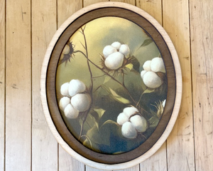 Cotton canvas print in wooden oval frame
*Made to order*

This canvas print of cotton with a green background is beautifully framed in an oval two-layer frame that features a dark stain and its natural tone. This print works well with all sorts of styles, including rustic farmhouse. Each print is handmade and imperfections in the wood may vary slightly due to the natural nature of materials.

This item is proudly made in the USA.

Materials:
Canvas, wood, sawtooth hanger

Dimensions:
9 3/4" wide x 11 1/2" l