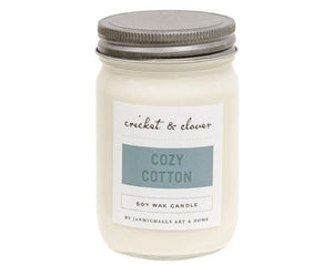 The cozy cotton candle is a hand-poured candle made of premium soy wax. This candle has a single lead-free wick for a slow and even burn, lasting up to 84 hours in burn-time. The candle features the soft, fresh scent of crisp perfumed cotton linens, and includes a screw-top lid to preserve the original aroma. Pair this candle with a ring or mat for a decorative display year-round.&nbsp;  This item is proudly made in the USA.  Materials: Glass, soy wax