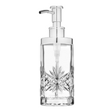 Clear glass soap dispenser with silver pump on a white background