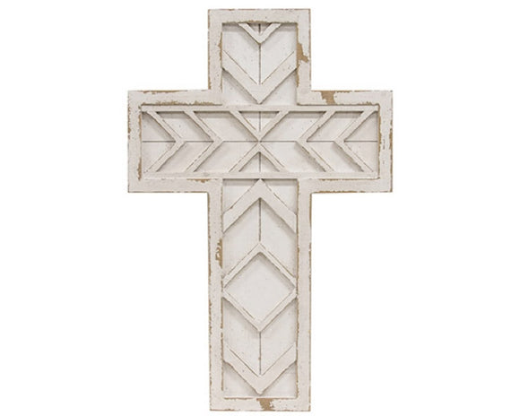 Decorative white cross with geometric patterns on a white background