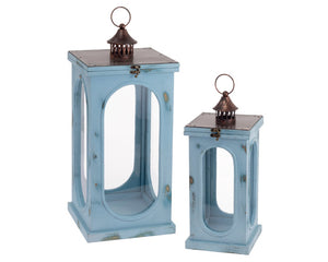 Distressed dusty blue wooden candle lantern set

This lantern set is perfect for a lake house. Each lantern features a distressed dusty blue finish accented by a metal top. Your purchase includes one lantern of each size.

Materials:
Wood, glass, metal

Dimensions:
Shorter lantern -
7" wide x 7" deep x 17" high

Larger lantern -
10" wide x 10" deep x 22 1/2" high