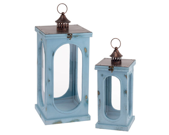 Distressed dusty blue wooden candle lantern set

This lantern set is perfect for a lake house. Each lantern features a distressed dusty blue finish accented by a metal top. Your purchase includes one lantern of each size.

Materials:
Wood, glass, metal

Dimensions:
Shorter lantern -
7