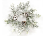 Frosted wreath with pinecones on a white background