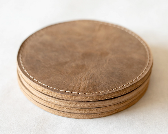 Set of 4 leather coasters

Protect your surfaces in style with our handmade leather coaster set, crafted from premium full-grain leather sourced from American-raised cows. These coasters are designed for durability and sophistication. Each set includes four coasters with sewn edges for a refined finish.

This item is proudly made in the USA.