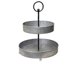 Distressed galvanized tiered tray with handle

This tiered tray features galvanized metal trays stacked using a black metal bar with a loop handle and rounded feet. Each tier has raised sides for displaying decorative fruits and fillers and offers a fresh farmhouse look to any decor. This tiered tray would also work well as part of a buffet at a party.

Materials:
Metal

Dimensions:
13" diameter x 16" high

Please note:
Some assembly is required.