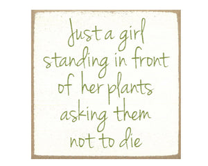 Gardening-themed tiered tray sign

Show of your sense of humor with this funny block sign. It reads, "Just a girl standing in front of her plants asking them not die," in green cursive font atop a creamy white background. This would look adorable next to a few of your favorite houseplants.

Materials:
Wood

Dimensions:
4" wide x 3/4" deep x 4" high