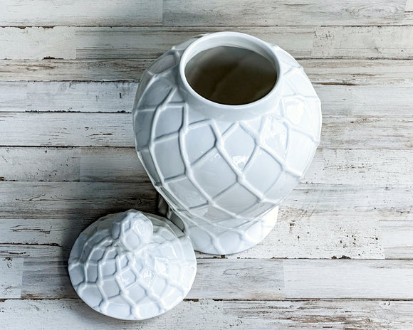  Introducing this elegant ginger jar that is perfect for adding a touch of classic beauty to your interior design. This lovely jar features an intricate textured pattern and removable lid. It is ideal for enhancing any collection of home decor, no matter the theme. Use as a standalone piece, showing off a freshly picked bouquet of flowers or combine it with the matching small and extra-large jars for an even more spectacular effect. 