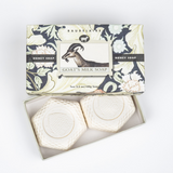 Two goat's milk soaps in a decorative box with floral design and 'Baudelaire' branding.