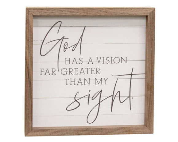 Wooden-framed sign with motivational quote on a white background
