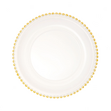 Clear plate with gold bead border on a white background
