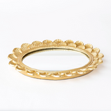 Elevate your living space with mirrored tray, a perfect blend of elegance &amp; functionality. It is expertly crafted from durable aluminum with a chic gold finish, adding a touch of sophistication to any room. Whether used as a centerpiece on your dining table or a stylish organizer for your favorite perfumes on your vanity, its reflective surface highlights your decor with a touch of glamour. Designed in the USA &amp; imported, the tray includes a convenient hook for hanging, allowing it to double as a wa