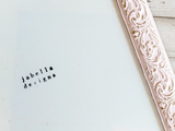 Decorative pink object with intricate patterns on a light blue background, featuring 'jabella designs' text.