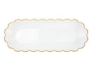 Clear scalloped-edge plate with gold rim on a white background