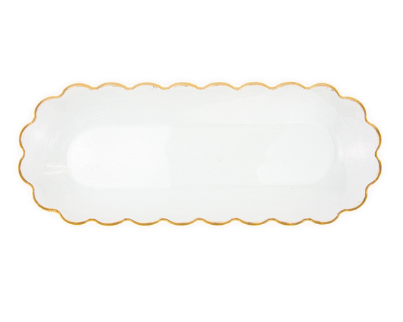Clear scalloped-edge plate with gold rim on a white background