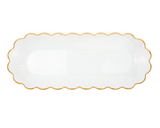 Clear scalloped-edge plate with gold rim on a white background
