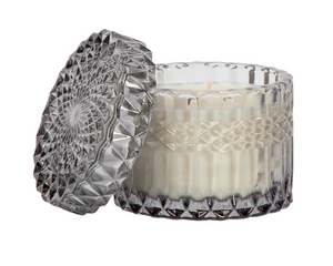 'Heathered Suede' holiday candle&nbsp;

Featuring hints of brushed suede with the deep comfort of oak moss embers and cleansing palo santo, this gorgeous hand-poured candle is perfect for year-round use. It comes in a shimmery glass jar with matching lid. The container is beautiful and can easily be repurposed when the time comes. This candle, which is vegan and cruelty free, is a great option for a housewarming gift.

This item is proudly made in the USA.
