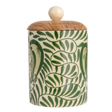 This round stoneware canister with a botanical design and acacia wood lid is a delightful addition to any countertop. Its round shape and natural green palette evoke a sense of calm, reminiscent of a garden in bloom. The acacia wood lid fits snugly, preserving the contents while adding a touch of rustic elegance. Whether used for storing tea, coffee, or sweet treats, or simply as an accent piece, this canister is a functional yet decorative element that complements farmhouse, Scandinavian, or rustic decor w