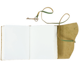 Open notebook with a brown leather cover and strap on a white background