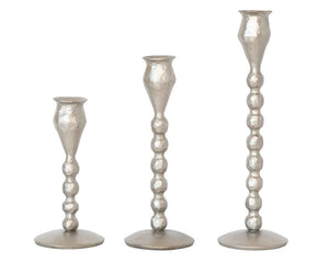 Lot of antique silver ball taper candle holders

Add unique charm to an entryway or bathroom with these candle holders. Each one features an antique silver finish accented with multiple balls along the stem. These candle holders make for a great wedding gift as well.

These candle holders are sold in sets of three, one of each size.

Materials:
Iron

Dimensions:
Shortest candlestick -
2 3/4" round x 6" high

Medium candlestick -
2 3/4" round x 8" high

Tallest candlestick -
2 3/4" round x 9 1/2" high