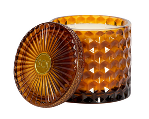 Brown textured candle with lid on a white background