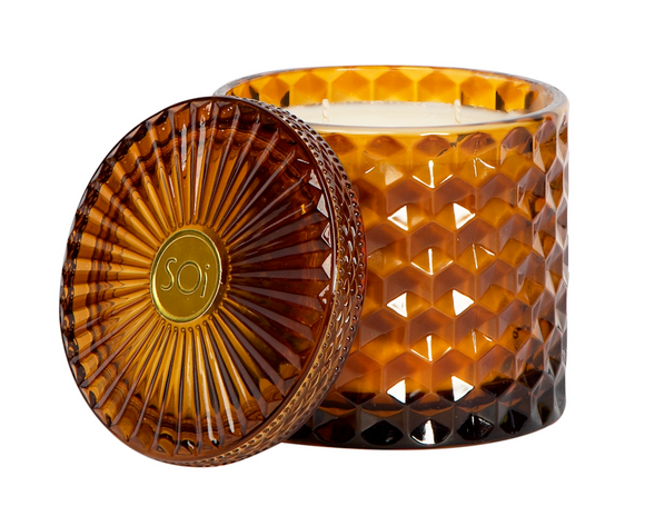 Brown textured candle with lid on a white background