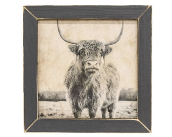 Neutral toned Highland cow framed print

This print is an eye-catching art piece set in a versatile wooden frame. The print depicts a fluffy Highland cow standing in a field. A vintage monochrome filter and weathered effect give the print an antiqued look. The frame is painted black with a distressed finish and features a pre-cut keyhole hanger.

Materials:
Wood

Dimensions:
13 1/2