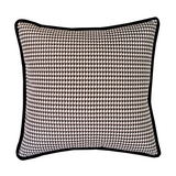 Houndstooth patterned pillow with black border on a white background