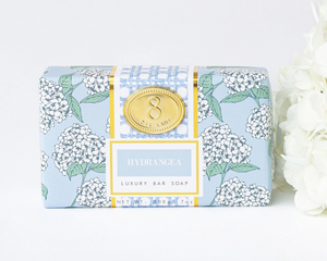 Luxury bar soap with floral packaging on a white background