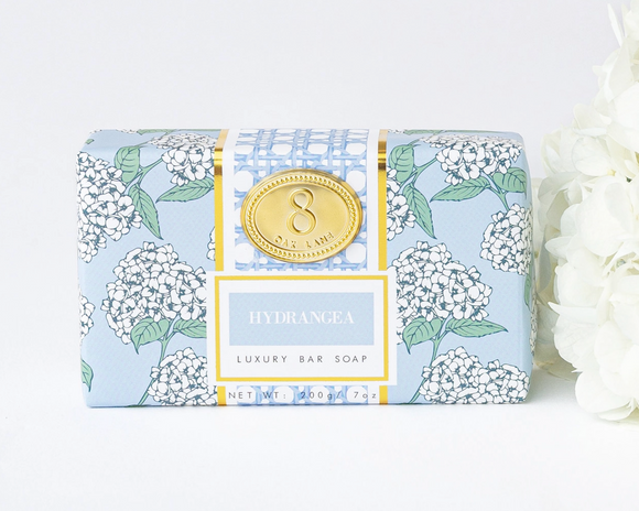 Luxury bar soap with floral packaging on a white background