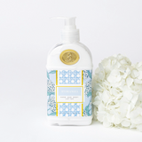 Hand and body blooming hydrangea lotion bottle with floral design on a white background