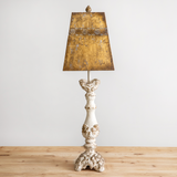 Add drama to an entryway with this gorgeous tall buffet lamp. The shade is made of metal in metallic tones, and the ornate lamp base is made of wood. The harp coordinates well with the shade. The lamp features an on/off rocker switch on the cord. It requires a 60-watt standard light bulb, which is not included. Pictures do not do this lamp justice.