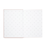 Open notebook with grid and dot grid pages on a white background
