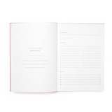 Open notebook with lined and blank pages on a white background